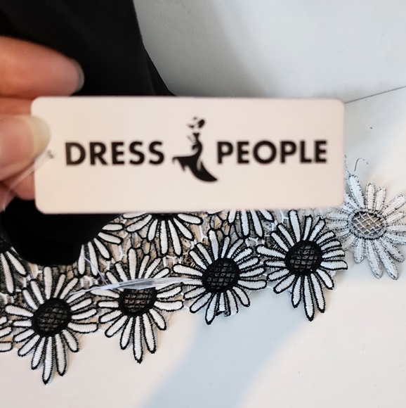 NWT Cartise Black Cut Out Sleeve Bottom Angled Top with Appliqued Flower Trim - Picture 8 of 12